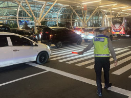 Polres Bandara Ngurah Rai Pastikan Kelancaran Lalu Lintas di Terminal Internasional
